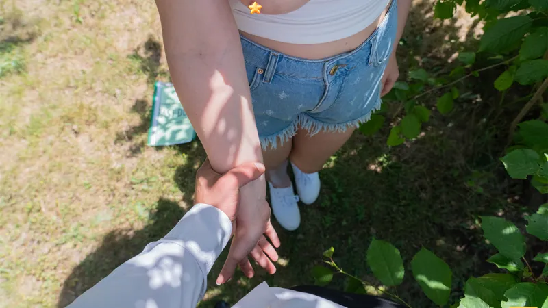 Point-of-view shot: Millie takes Billy by the wrist and leads him deeper into the garden