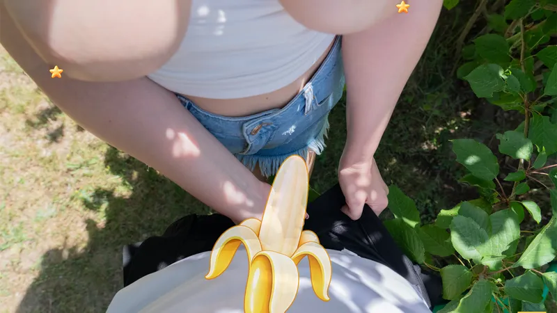 Point-of-view shot looking down as Millie kneels in front of Billy in the grass